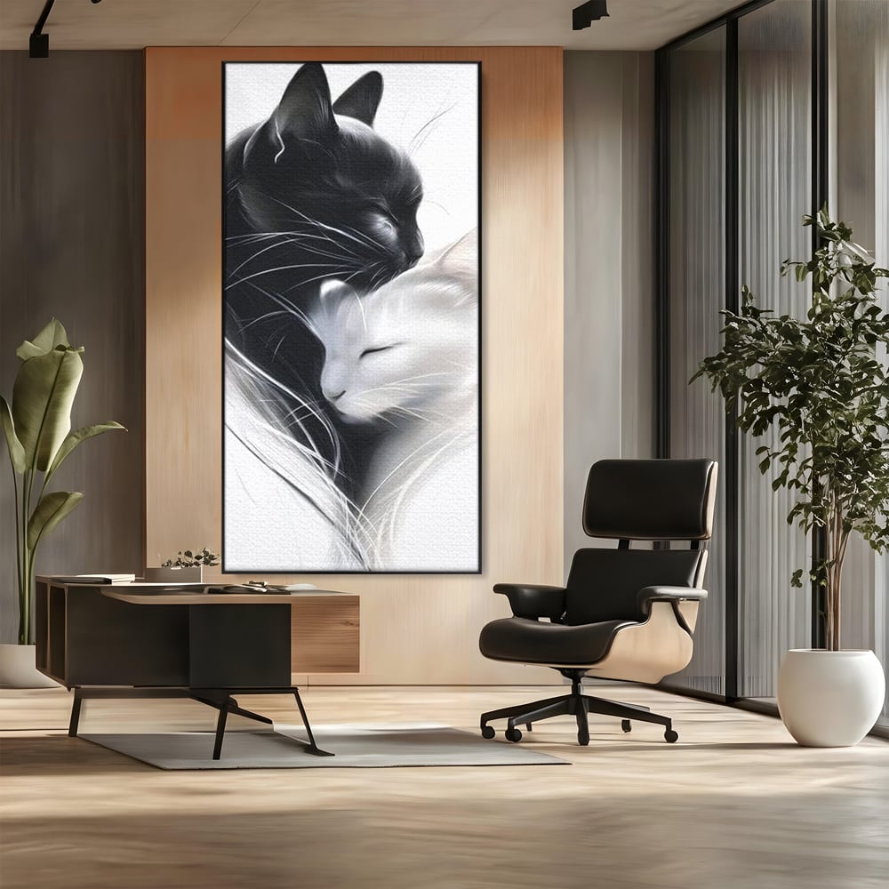 Tablou canvas cu tablou canvas cu pisici alb si negru, in rama de aluminiu negru, pe perete intr-un birou